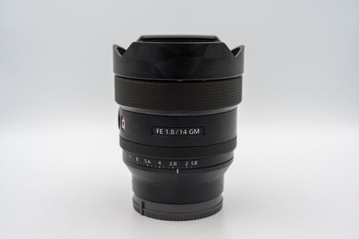 A closeup shot of full frame lens of Sony camera isolated on the white background