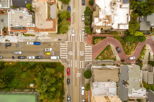 An overhead shot of the buildings and streets of a neighborhood