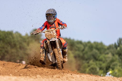 A motocross rider on a track practicing in Fulton, Missouri, USA