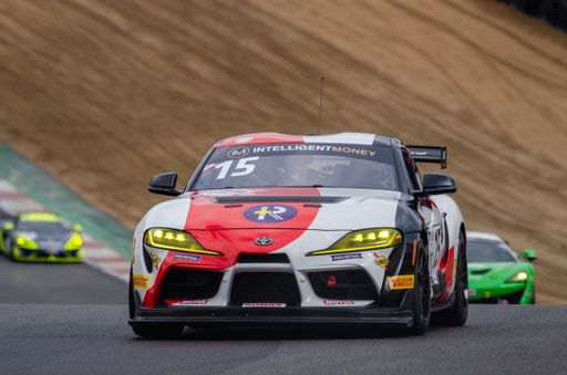 A low angle shot of a Lamborghini A Clear black car during the race in the British GT Championship,