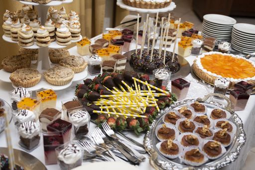 A closeup shot of sweet different desserts placed on the table - perfect for food blog and menu
