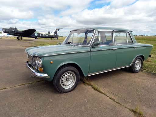old popular gray Fiat 1500 sedan family 1960s. Nature background in a sunny day. Side view. CADEAA MNA 2022 classic car show. Copyspace