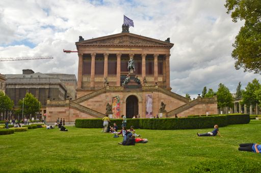 A beautiful shot of the facade of Alte Nationalgalerie against cloudy sky on a sunny day in Berlin, Germany.