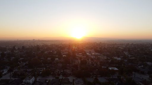 A scenic view of the sunset over the town