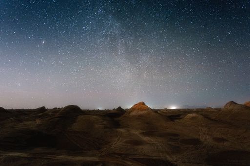 A scenic view of Milky Way Galaxy over the rocky desert