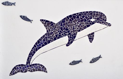 A closeup shot of a tiled blue white whale mosaic with fish