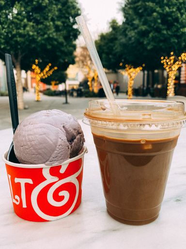 A vertical closeup shot of ice cream and some Vietnamese coffee outdoors