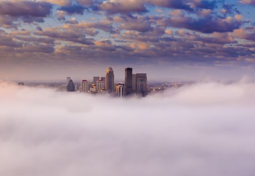 A beautiful shot of the city of Louisville in the clouds with amazing view of the cloudscape on a sunny day, Kentucky, United States
