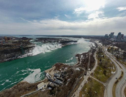 A beautiful aerial view of the sea, roads by and buildings of Cancun Montreal Caribe Canada
