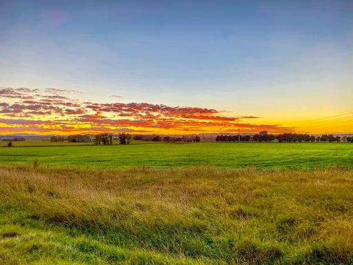 A mesmerizing view of the scenic sunrise over the field near the Glen Innes Airport, Australia