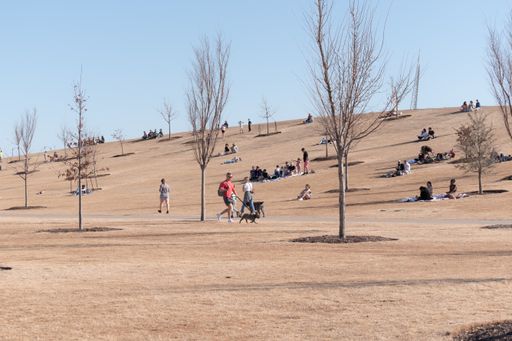 A shot of people enjoying time on a Sunny winter afternoon at Scissortail Park in Oklahoma City