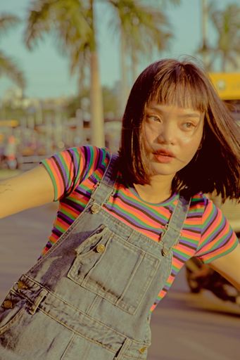 A view of stylish Asian girl with short hair posing in zoo bus