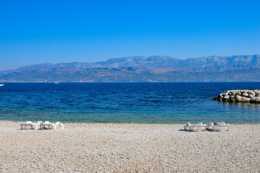 A view of the blue sea and rocks on the coast of Brac, Croatia's island in the Adriatic Sea.