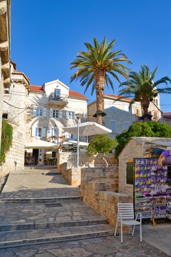 A vertical shot of a small street in a village Bol on an island in the Adriatic Sea, Croatia.