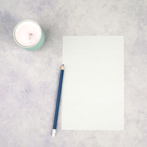 Empty paper with a pen and a cup of coffee, textured background, brainstorming for new ideas, writing a message, taking a break, home office desk