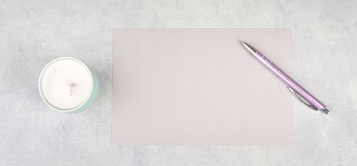 Empty paper with a pen and a cup of coffee, textured background, brainstorming for new ideas, writing a message, taking a break, home office desk
