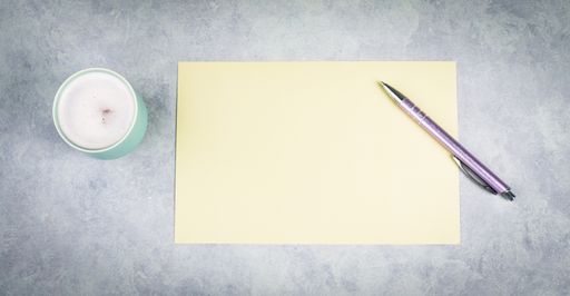 Empty paper with a pen and a cup of coffee, textured background, brainstorming for new ideas, writing a message, taking a break, home office desk