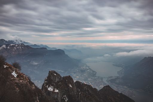 An aerial shot of snowy mountains of Piani dei Resinelli in Lecco, near Como Lombardy, Italy