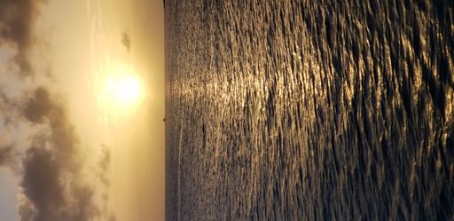 A vertical shot of a beautiful sea during a breathtaking sunset
