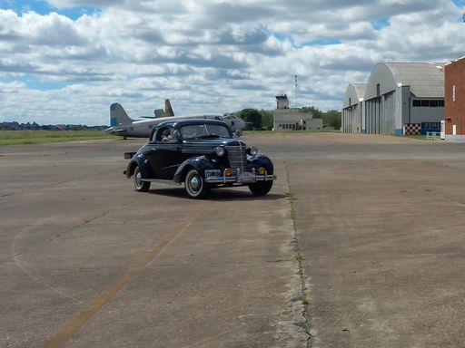Moron, Argentina - Mar 26, 2022 - old black Chevrolet Chevy Master coupe with rumble seat 1938 by GM. CADEAA 2021 classic car show.