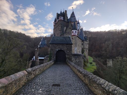 A beautiful shot of a walkway to the Eltz Castle on the hill