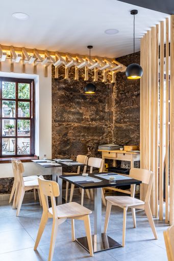 A vertical shot of an interior of a restaurant with contemporary design