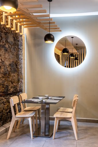 A vertical shot of an interior of a restaurant with contemporary design