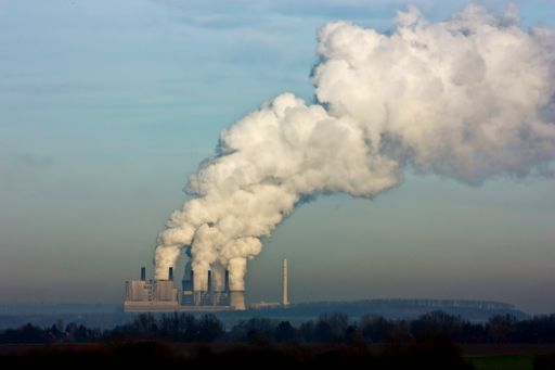 The huge smoke of nuclear power plant in Germany under cloudy sky