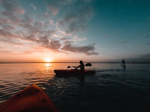 WWatching the sunrise from a Kayak in a lake of Mexico, Riviera Maya