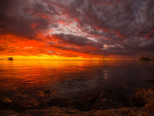 A beautiful landscape view of a dusk sky at sunset over Kwinana Beach, Perth, Western Australia.