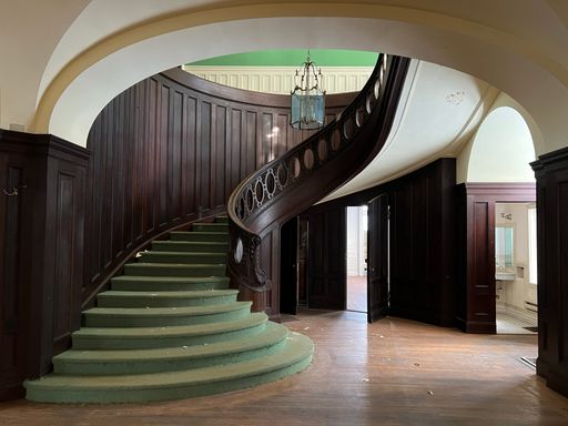 A beautiful green mansion staircase