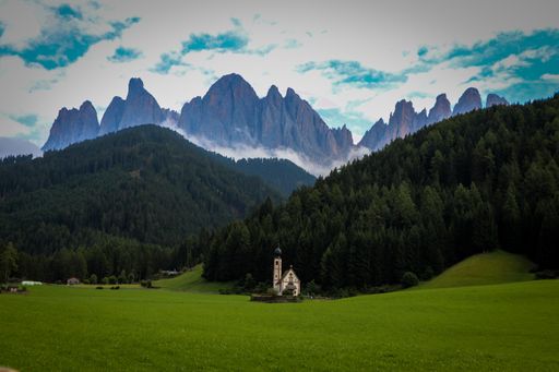 a Landscapes with San Giovanni Church and small village in Val di Funes, Dolomite Alps, South Tyrol, Italy, Europe
