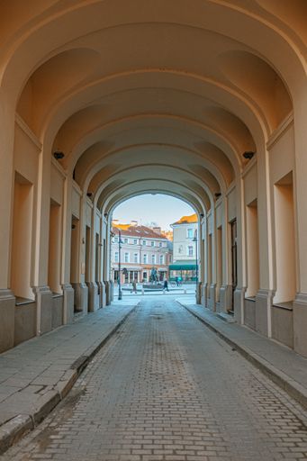 A beautiful vertical shot of a tunnel with arches in Vilnius