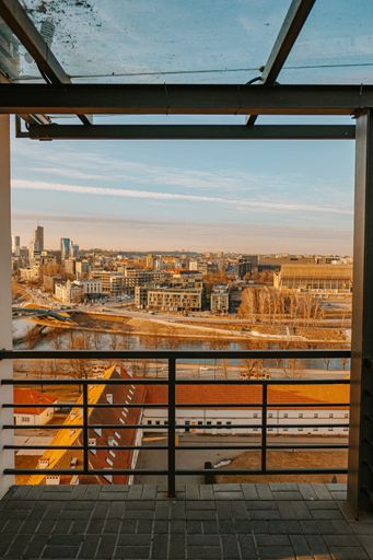 A vertical shot of a Vilnius city and Neris river from the balcony