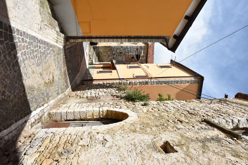 A medieval stone floor in the street among the houses of Macchiagodena village in Molise region, Italy