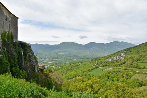 A beautiful landscape of Molise from the village of Macchiagodena, Italy, green meadow fields  and mountains and blue sky on the horizon