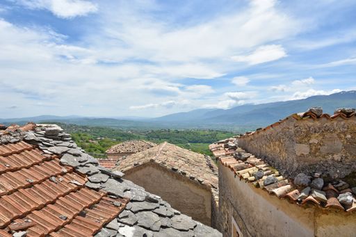 A beautiful landscape view of Molise stone buildings from the village of Macchiagodena, Italy with a cloudy sky