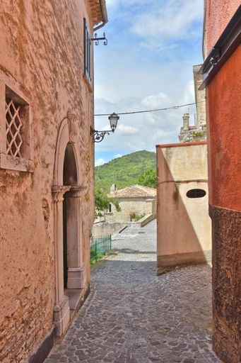 A narrow street among houses of Lagonegro with medieval stone walls village in the Basilicata region, Italy