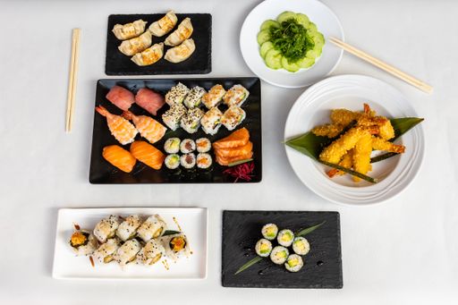 A Top view of sushi set on plates on a white background