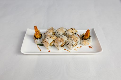 A closeup  of sushi set on a white plate on a white background