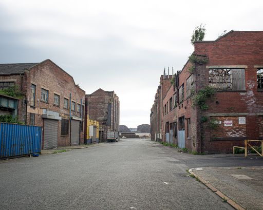 Old and derelict warehouse next to Bootle docks: area awaiting eventual redevelopment. Bootle, Liverpool, UK