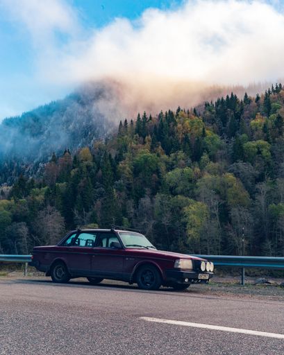 Volvo car parked on roadside. Frozen morning, good light, beautiful mountain, you know.