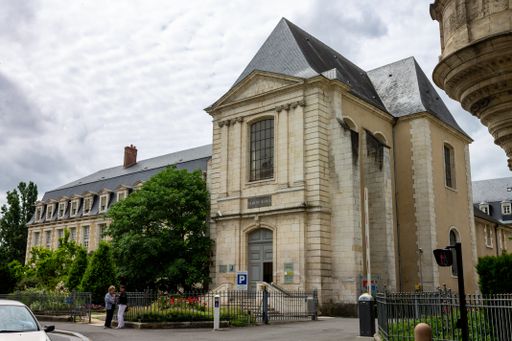 The historical building in Bourges, France against the cloudy sky