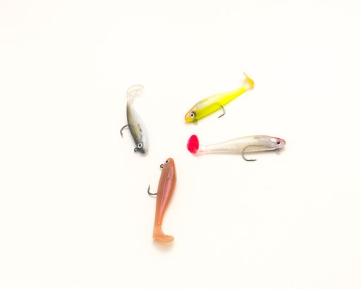 A top view of plastic artificial baits isolated on a white background