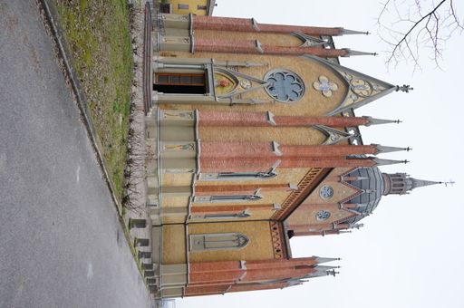 An exterior shot of the Church of Saint Mary 'di Venezzano Catholic church in Venezzano, Italy with a light sky