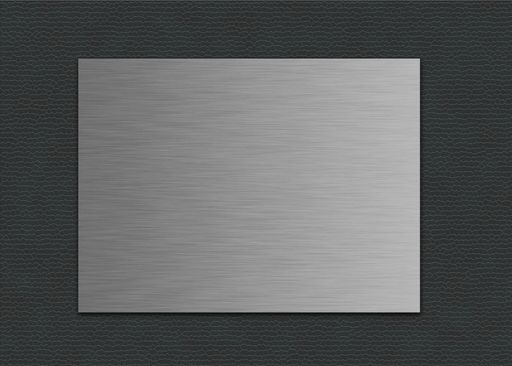A closeup shot of a metal sheet on a grey leather background