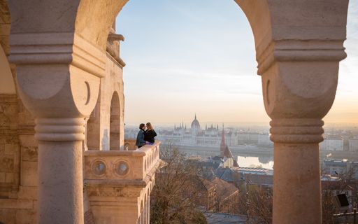 A romantic couple on the Parliament balcony in the city of Budapest, Hungary