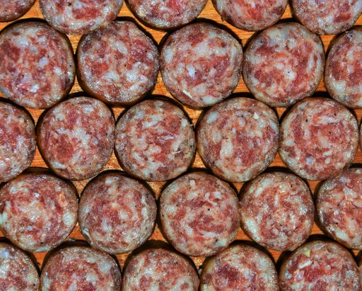 A closeup shot of slices of sausage arranged next to each other