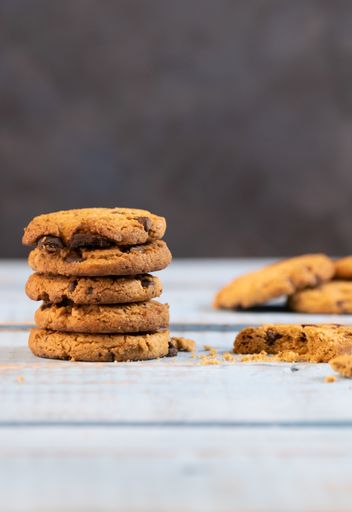 A closeup shot of chocolate cookies stack on wooden table