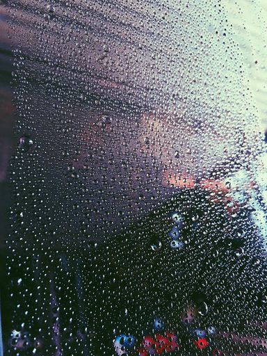 A close up shot of water droplets covering the glass surface